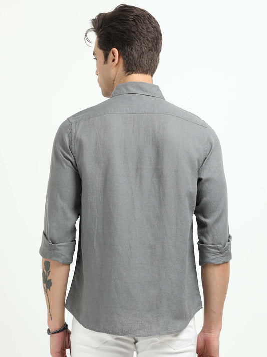 Man wearing a gray shirt from behind on a white background