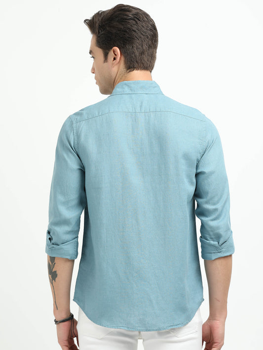 Man wearing a light blue shirt on a white background