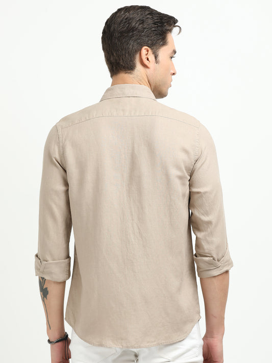 Man wearing a beige shirt on a white background