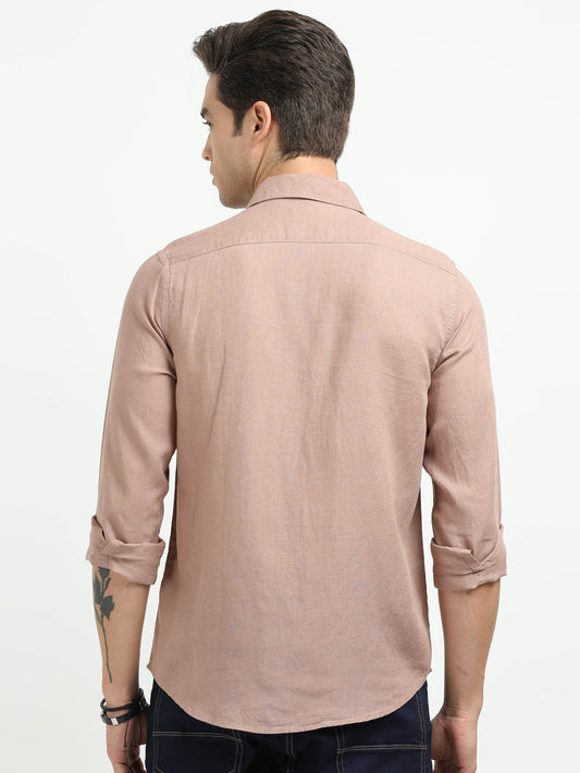 Man wearing a beige shirt on a white background
