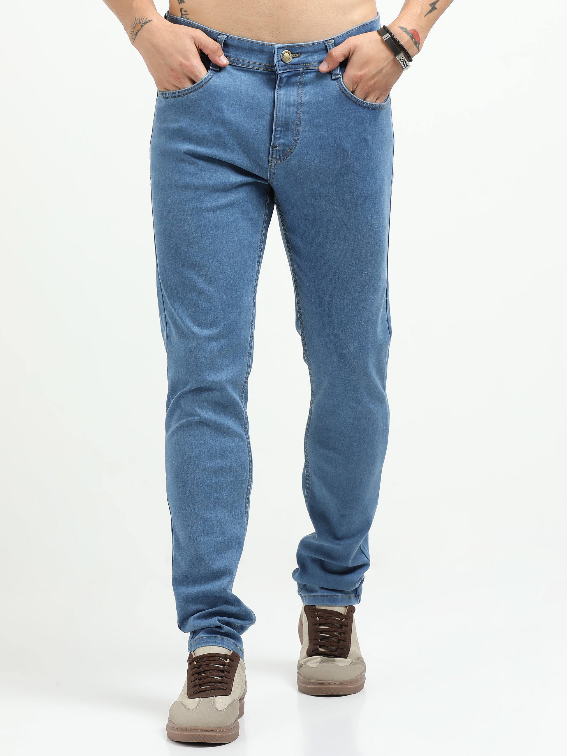 Person wearing blue jeans on a white background